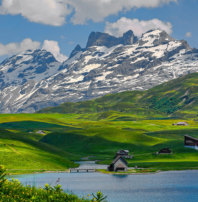 Alpine mountains and a lake, representing worldwide holiday possibilities